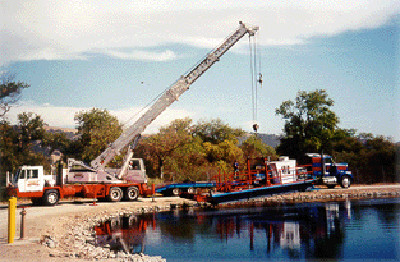 Launching a dredge into a treatment lagoon